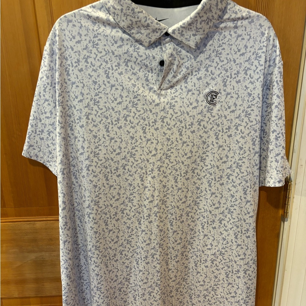 Nike White and Blue Polo Shirt with Subtle Pattern